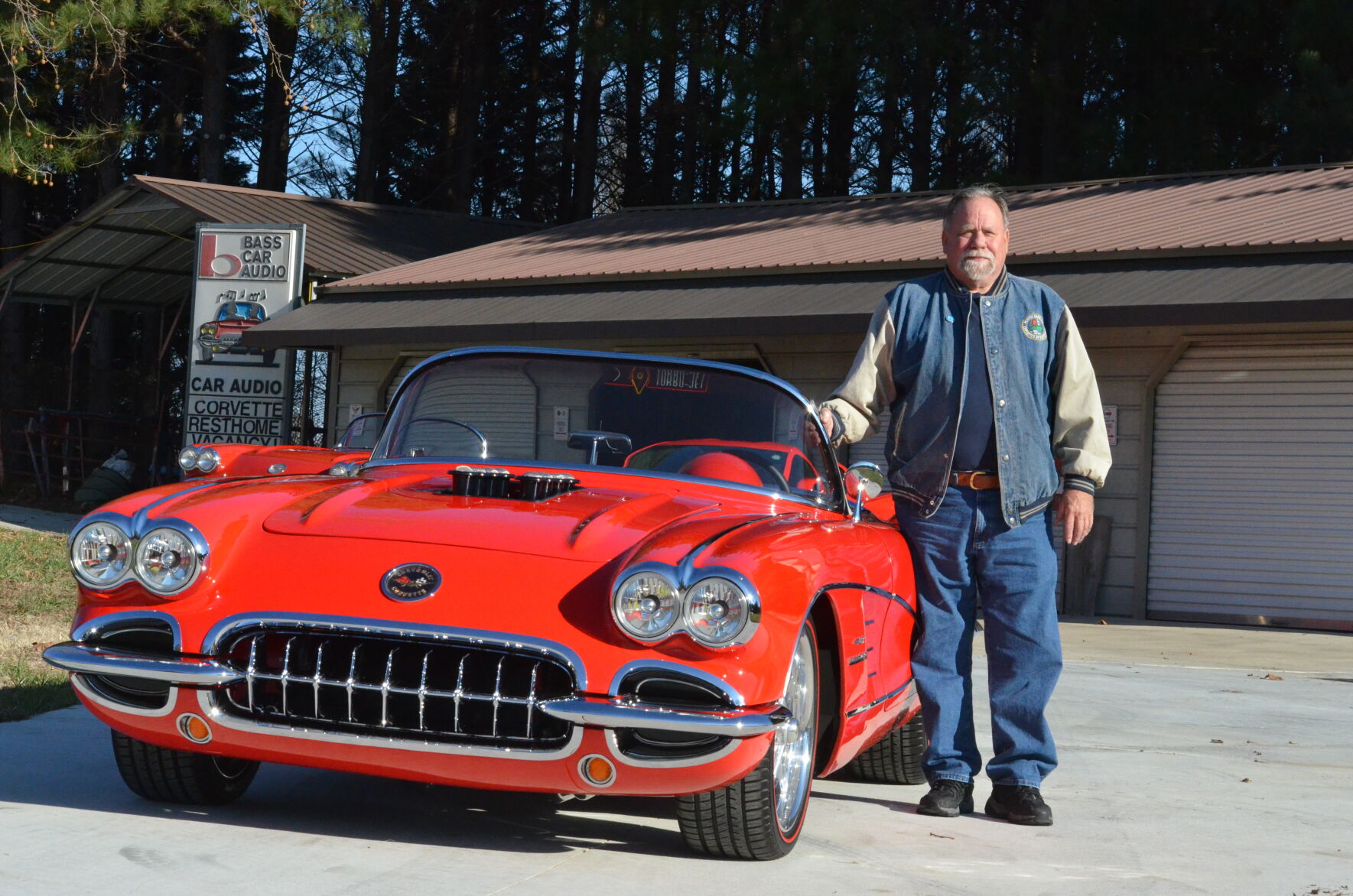 Jerry Lyndon stands beside his 1959 Chevrolet Corvette he customized.